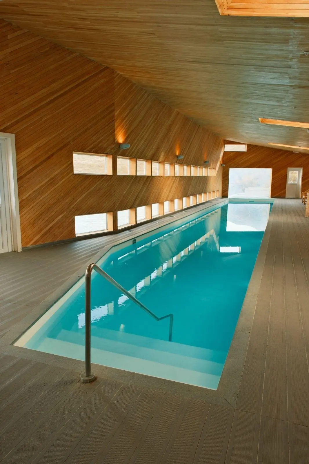 The indoor pool at Explora Patagonia under a slatted wooden roof