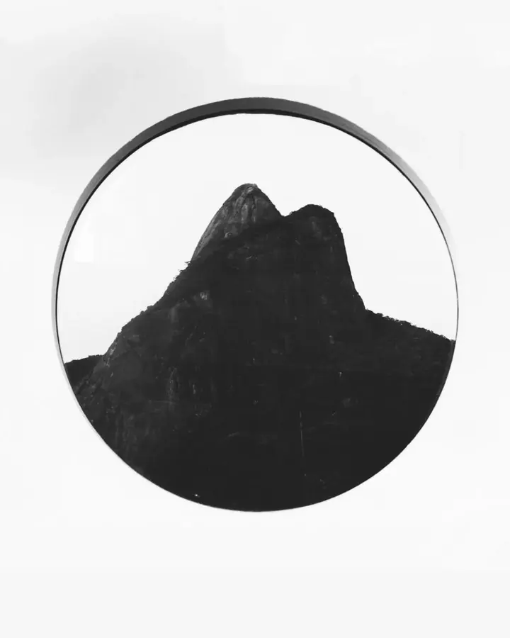 Article cover: Dois Irmãos framed by a round window at Janeiro Hotel