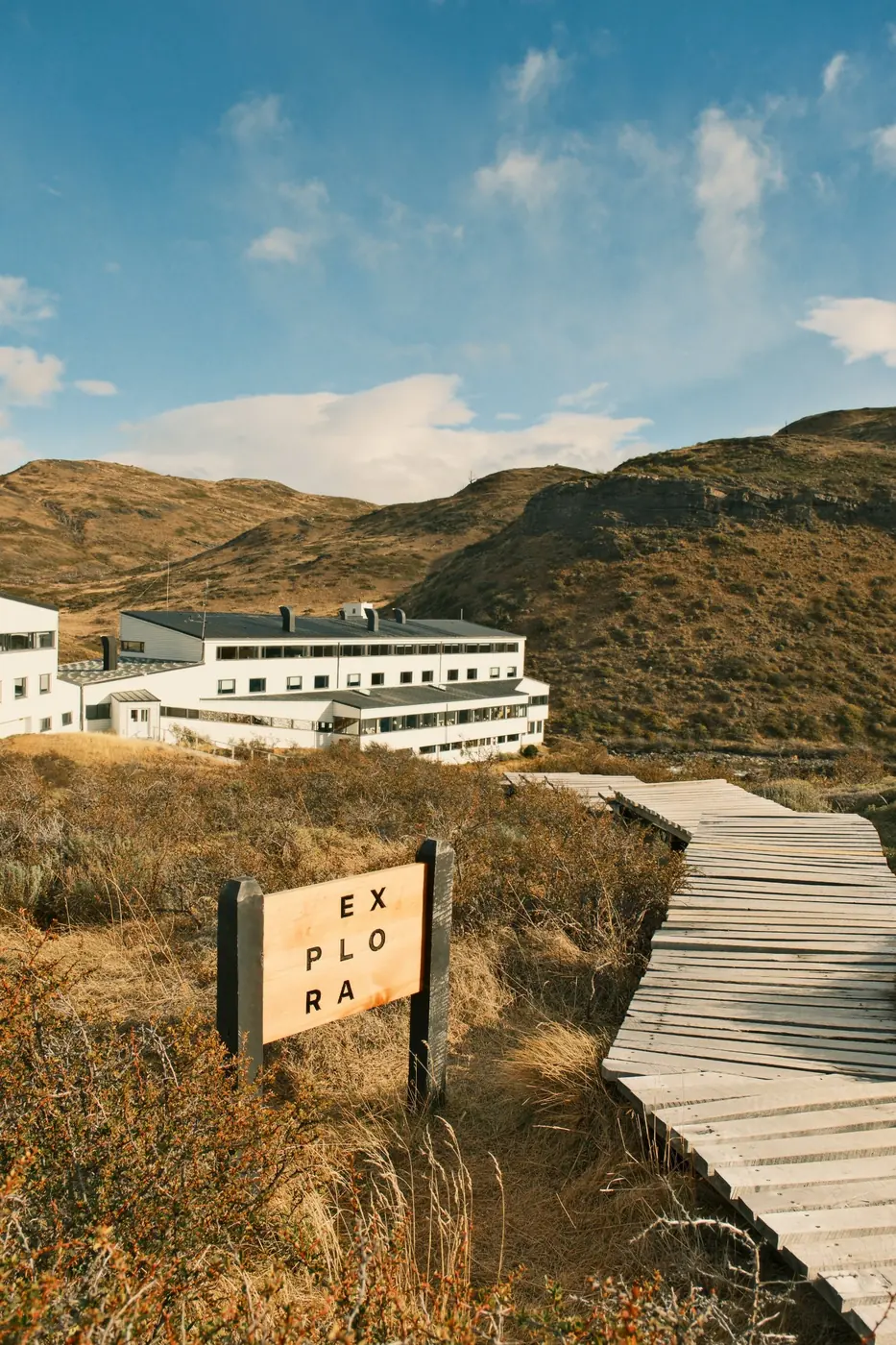 The Cuernos del Paine rising above the stepped white facade of the hotel